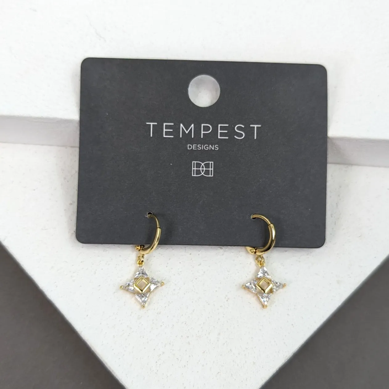 Four pointed crystal star on little hoop earrings